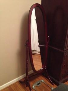 Frenchi Furniutre Traditional Style Cheval Mirror Cherry Finish next to the armoire