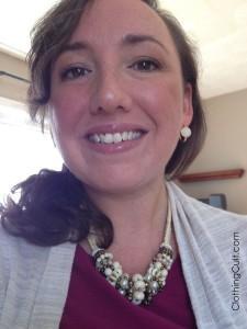 white jeans for fall winter wearing a white statement necklace and earrings